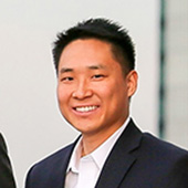 young woman with dark hair smiling